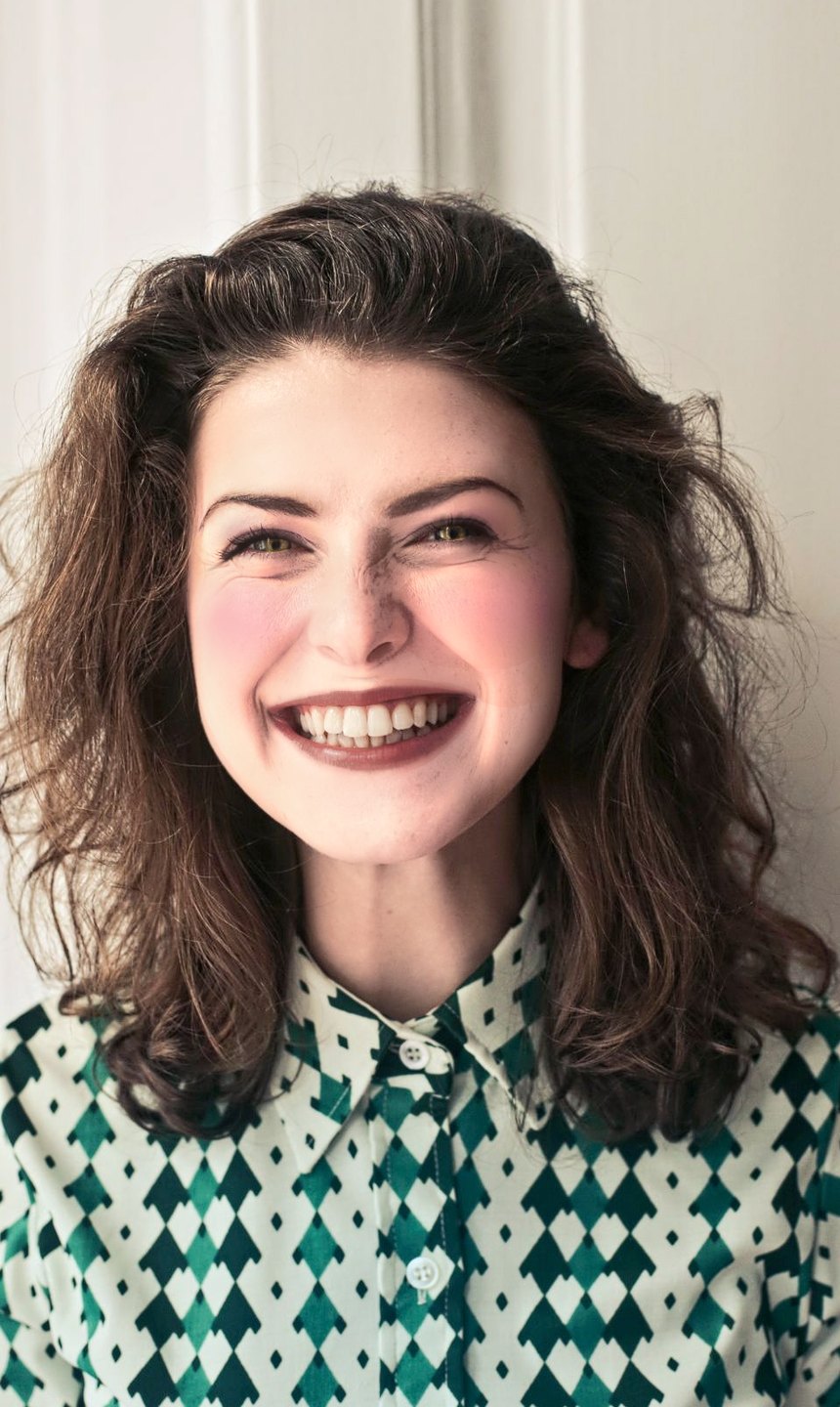 Big smile, teeth showing, with the Berry lip look